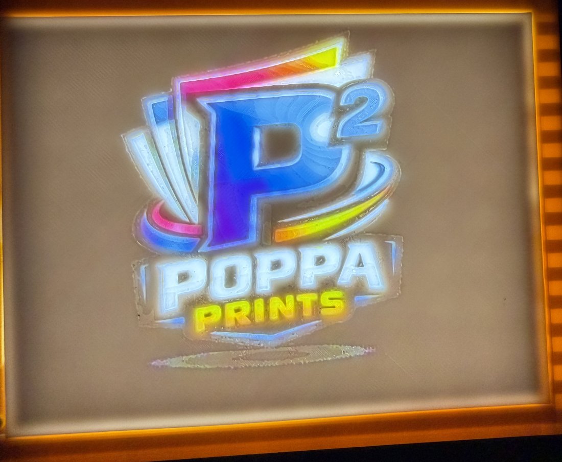 The Poppa Prints P-squared logo printed as a glowing backlit lithophane